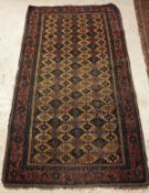 A Caucasian rug the central panel set with repeating tile decoration with blue,