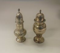 WITHDRAWN An Edwardian silver sugar caster of baluster form with embossed floral and C scroll