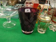 An etched amethyst glass beaker vase decorated with tulips signed to base "Webb",