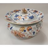 A Chinese Imari pot and cover with all over blue underglaze and oxide red and gilt overglaze floral