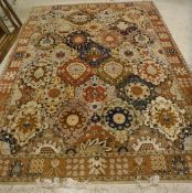 A Persian carpet, the central panel set with all over multi coloured floral set medallions,