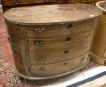 A 19th Century mahogany oval shaped chest the plain top above four long graduated drawers raised on