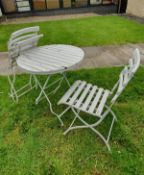 A painted wooden and metal Bistro style garden table and two chairs