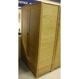 An Ercol oak two door wardrobe with single drawer to base (to match Lot 499) Dimensions (Approx):