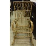 A modern cane conservatory rocking armchair and a Victorian oak framed salon chair