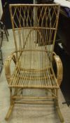 A modern cane conservatory rocking armchair and a Victorian oak framed salon chair