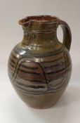 RAY FINCH (1914-2012) for Winchcombe Pottery - a large jug with iron rich glaze and serpentine