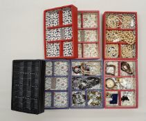 A collection of assorted costume jewellery to include beaded necklaces, rings,