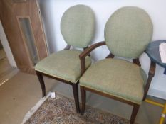 A composite set of twenty olive green upholstered spoon back chairs in the Georgian style (two on