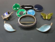 A collection of Norwegian and other enamelled brooches to include a butterfly brooch in the style