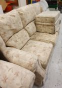 A modern floral upholstered four piece suite comprising three seat sofa,