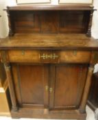 A Regency rosewood chiffonier with shelved superstructure over two drawers and two cupboard doors