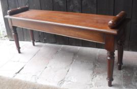 A mahogany window seat in the Victorian manner,
