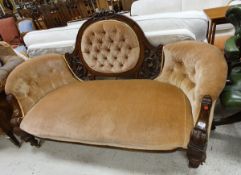 A Victorian walnut framed show frame salon sofa with carved decoration