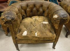 A pair of Victorian button back leather upholstered tub chairs,