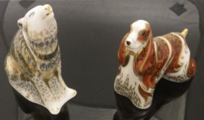 A Royal Crown Derby figure of a wolf (MM1V) and another of Amercian Spaniel (MMV)