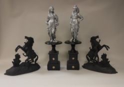 A pair of painted spelter "Marley Horse" figures after the original by Coustou together with a pair