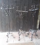 A pair of wrought iron Spanish two branch candelabra,