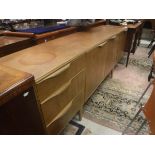 A McIntosh of Glasgow teak sideboard with three doors and three drawers