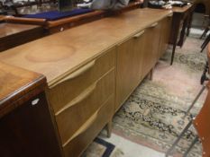 A McIntosh of Glasgow teak sideboard with three doors and three drawers