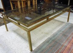 A vintage 1970's brass rectangular coffee table with smoked glass top Dimensions (Approx): Height