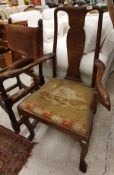 A 19th Century elbow chair with vase shaped splat back and eagle head finials to tapestry seat