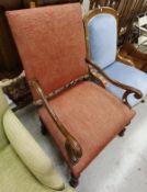 A 19th Century French walnut framed armchair with upholstered back and seat above an X stretcher