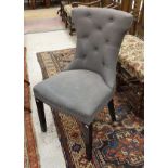 A set of four modern grey buttoned and studded upholstered chairs in the Etruscan style,