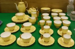 An Aynsley "Butterfly" pattern tea / coffee set comprising twelve teacups and saucers,