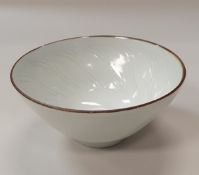 DEREK EMMS (1929-2004) - a porcelain bowl with white glaze and carved decoration,