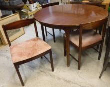 A vintage mahogany McIntosh extending circular dining table and set of four chairs pattern No.