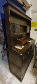 An oak dresser in the Old Charm manner, a similar glazed cabinet,