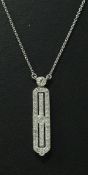 An 18 carat white gold diamond studded pendant of rectangular form in the Art Deco taste