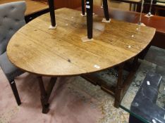 A 19th Century oak oval gate-leg drop-leaf dining table in the circa 1700 manner,