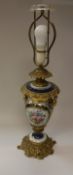 A 19th Century Continental gilt brass and porcelain mounted vase table lamp with classical style