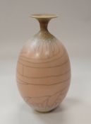 DAVID WHITE (1934-2011) - a porcelain narrow-necked vessel with flared rim with pink / peach