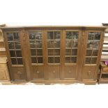 A Continental oak breakfront bookcase cabinet in the Victorian manner,