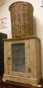 A pine meat safe together with two cane baskets with lids