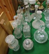 A collection of various glass and cut glass decanters to include ship's decanters,