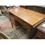 A G Plan teak dressing table with single drop flap and one long and two short drawers on square