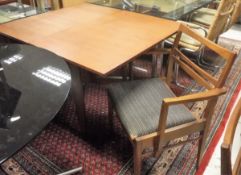 A mid 20th Century teak folding drop-leaf dining table with four bar-back chairs (two plus two)