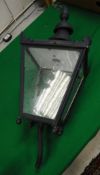 A 20th Century painted metal exterior lantern with wall mounting in the Victorian style