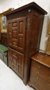 An early 18th Century Continental oak two door cupboard with panelled doors,