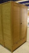 An Ercol oak two door wardrobe with single drawer to base (to match Lot 498) Dimensions (Approx):