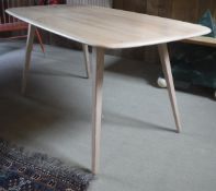 An Ercol beech plank table on square tapering splayed legs CONDITION REPORTS Light
