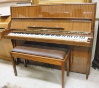 A modern mahogany case upright piano,