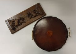 A carved Black Forest type telescopic book stand with chamois decoration and a small Edwardian