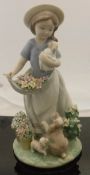 A Lladro figure "A Romp in the Garden" (6907) CONDITION REPORTS Some light surface