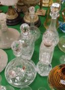 A collection of six various cut glass decanters