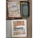 A brown case containing various stamp albums and contents,